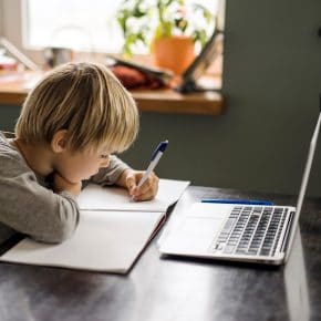 Child at home in front of computer EBB