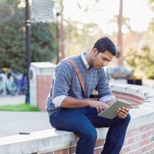 College Student on Campus with Device