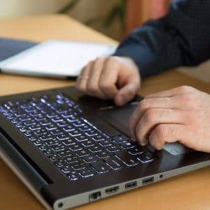Man hands on laptop
