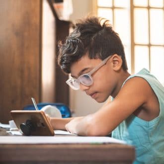 Student at home doing schoolwork.