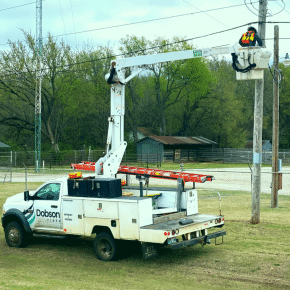 Dobson Fiber technician working electrical poll.