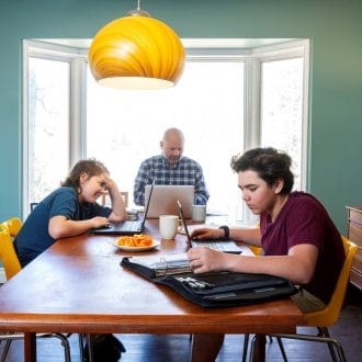 Family on computers at home