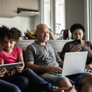 Family on devices at home