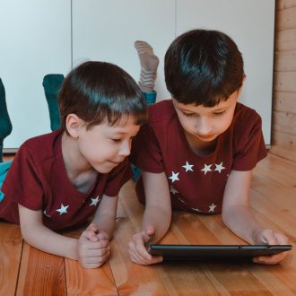 Kids on tablet at home