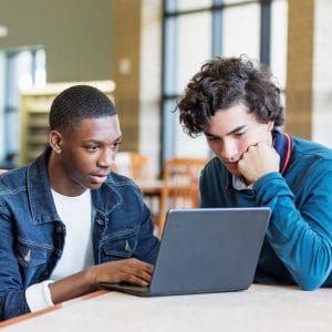Students at library on laptop