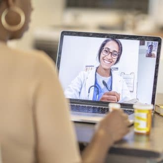 Doctor consulting patient virtually