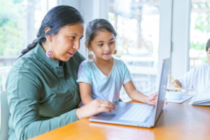 Tribal: Native American family on laptop