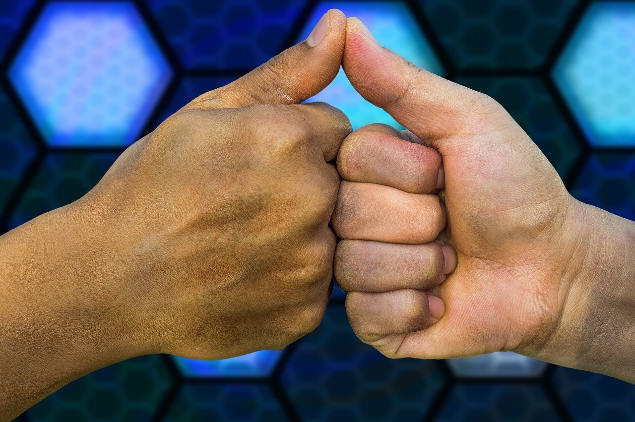 deal handshake bump