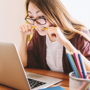 Lady annoyed with broadband connection on her laptop.