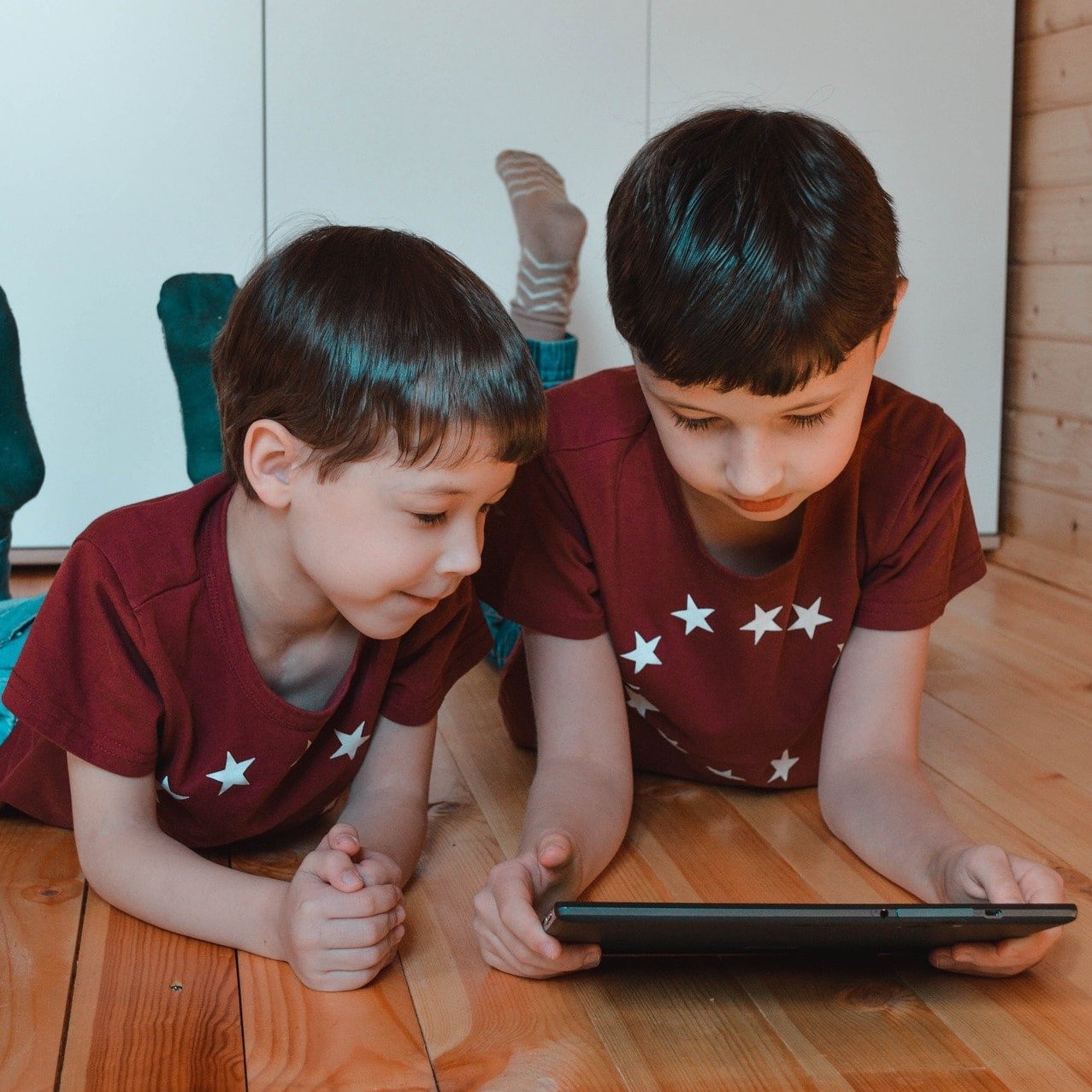 Kids on tablet at home
