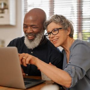 Senior couple on laptop at home