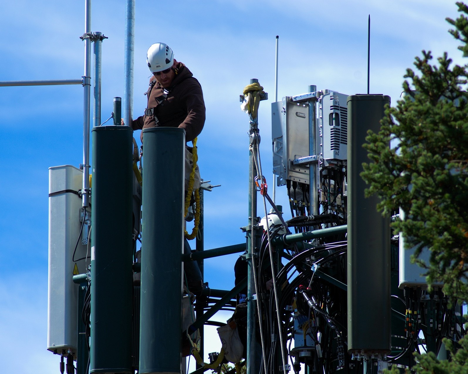 workman on cell tower